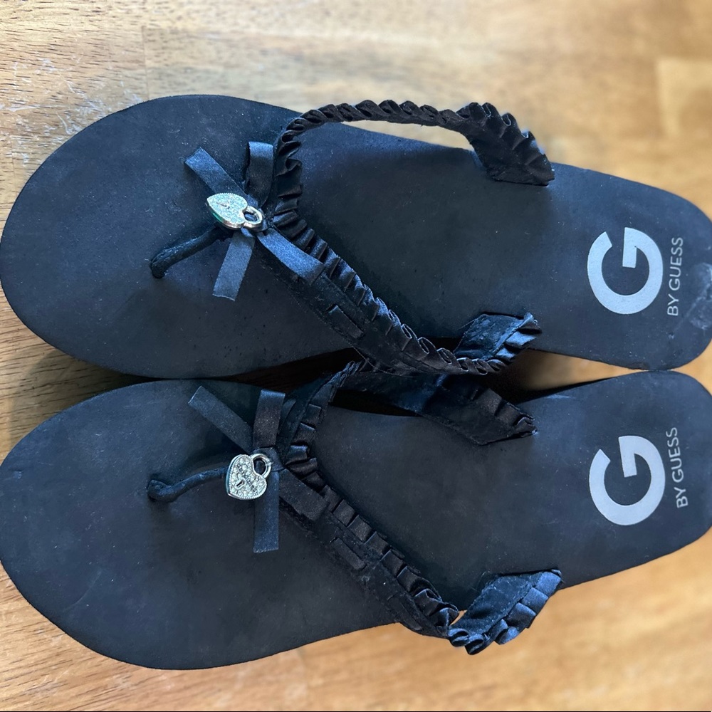 Guess black wedge sandals.